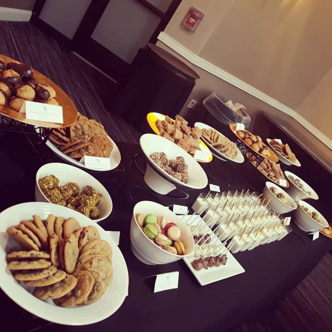 Moody dessert table with tiered stands and assorted sweets